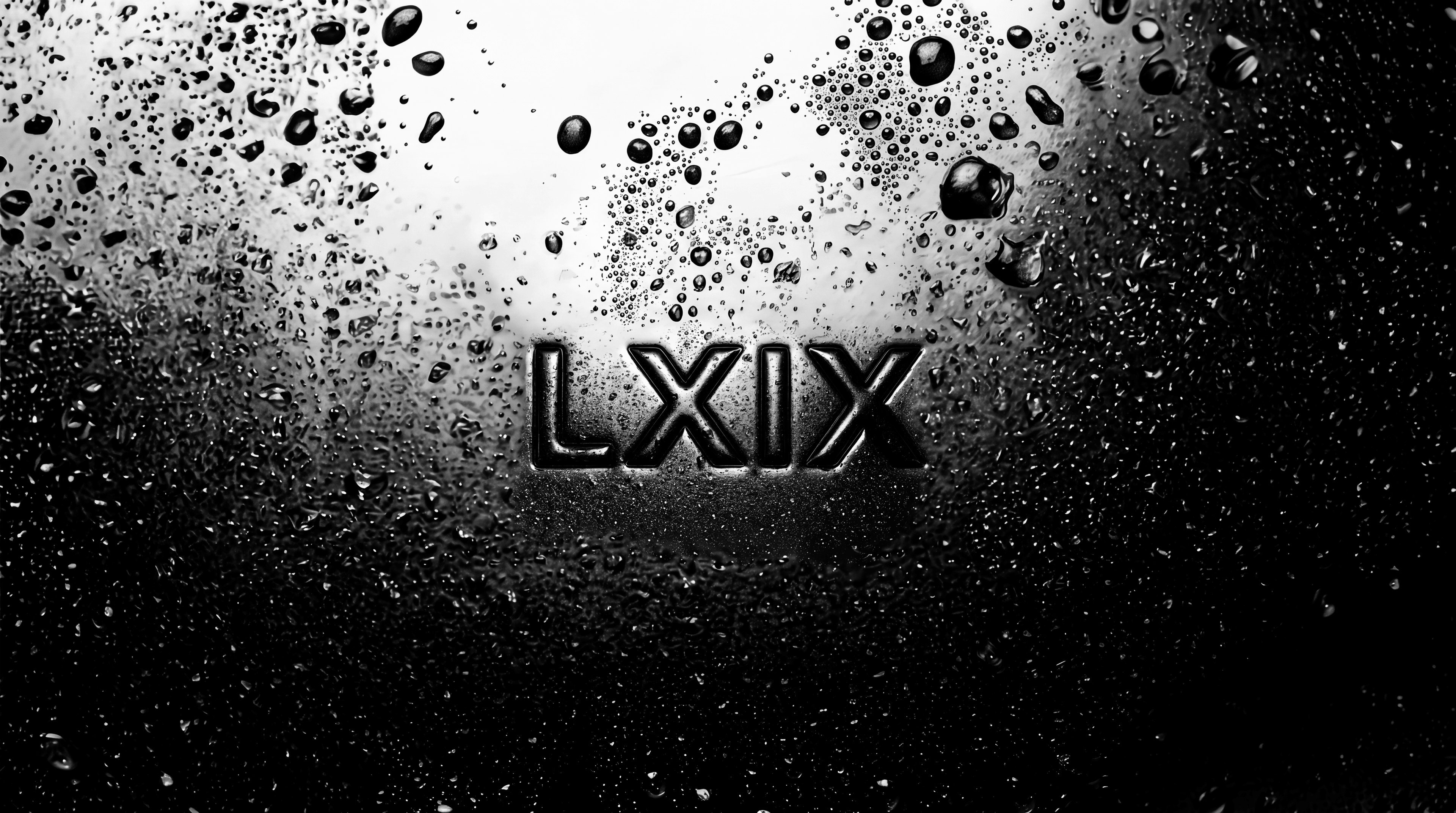 The LXIX wordmark etched in condensation on glass