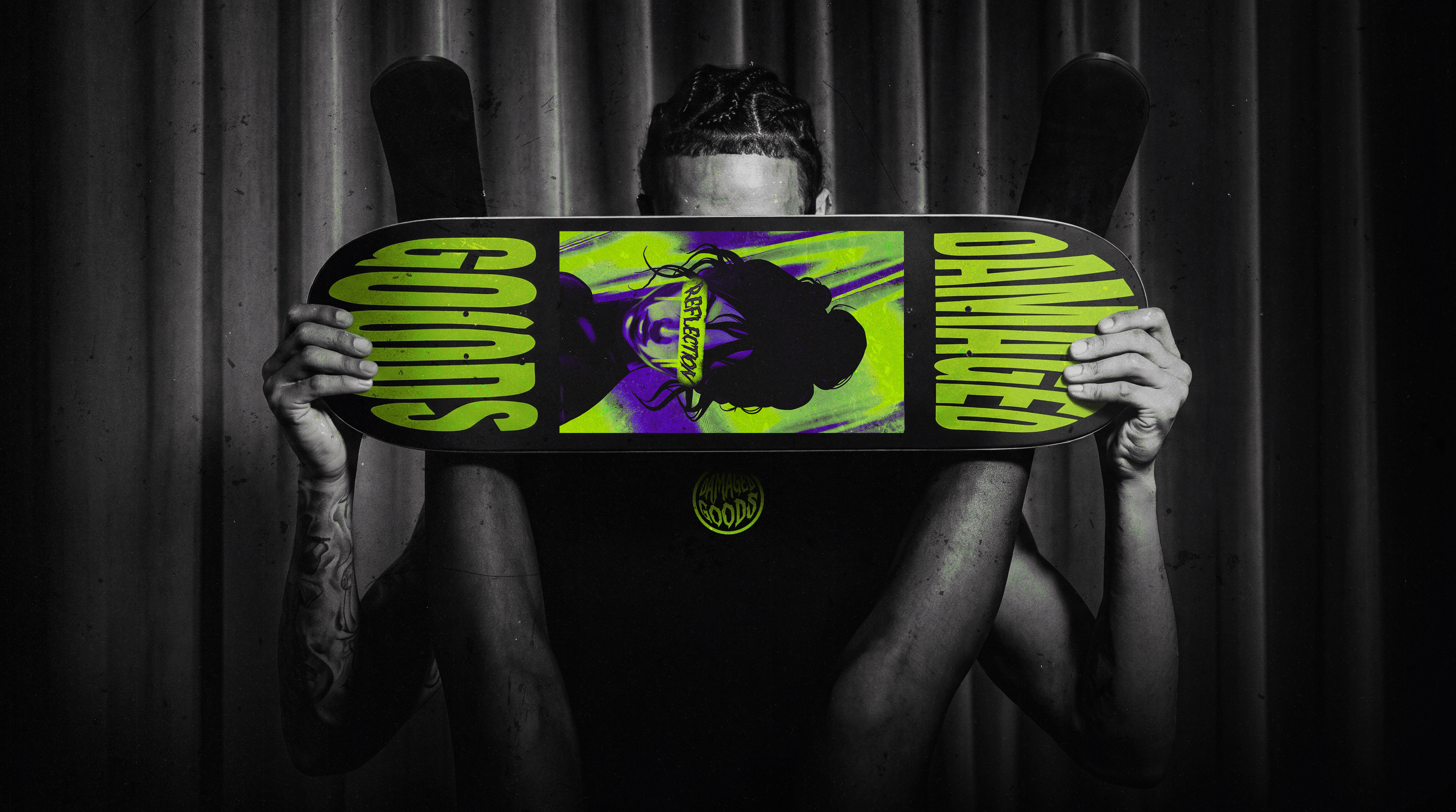 Damaged Goods branded skateboard deck, cropped portrait