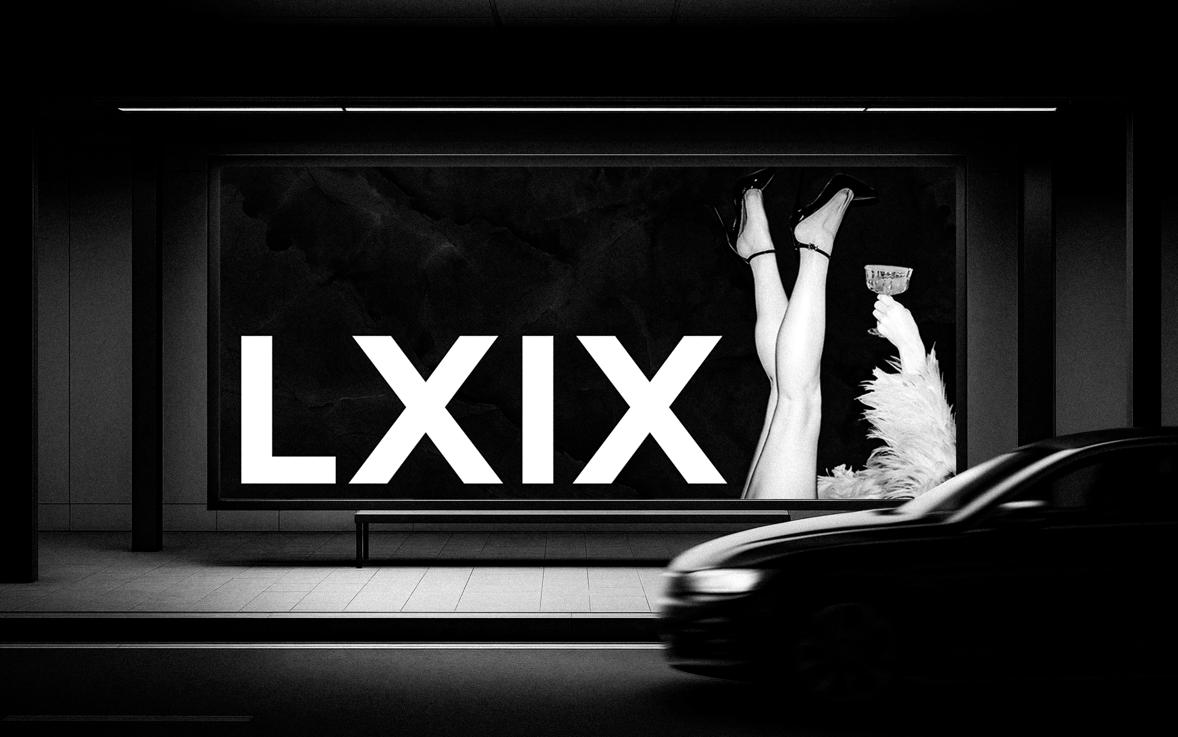LXIX wordmark lit on a night bus-stop billboard as a car passes