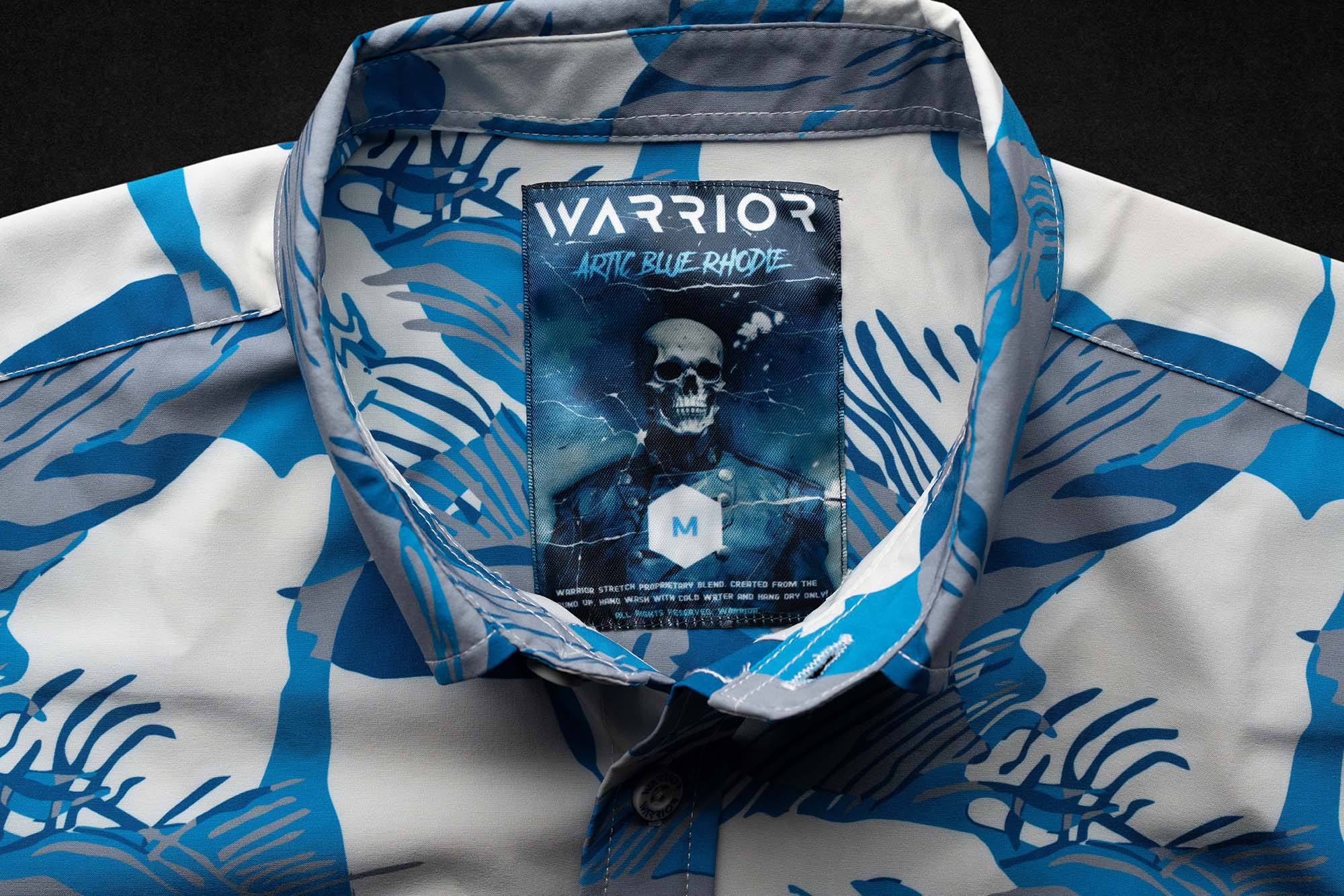 Artic Blue Rhodie tag sewn into a blue camouflage garment collar